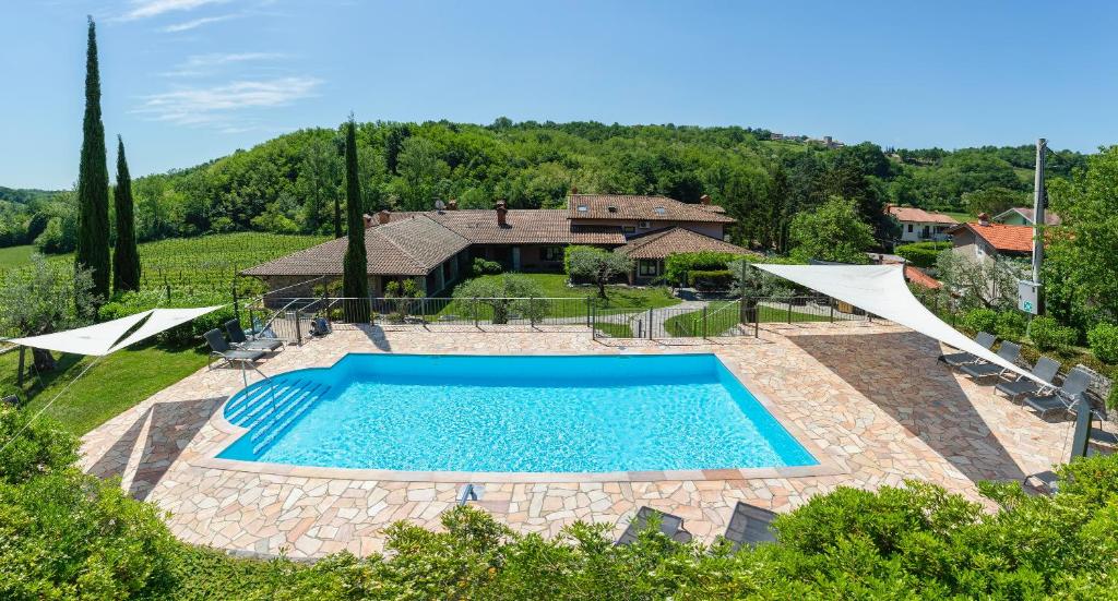 an overhead view of a swimming pool in a yard at Guest House Valentincic in Nova Gorica