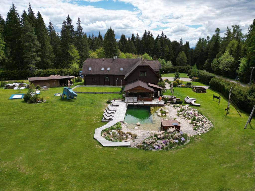 an aerial view of a backyard with a house at Penzion Sileo in Pribylina