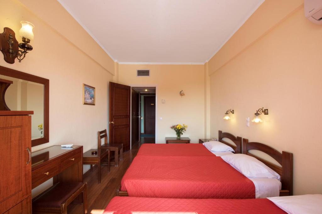 Postel nebo postele na pokoji v ubytování Sunset Hotel