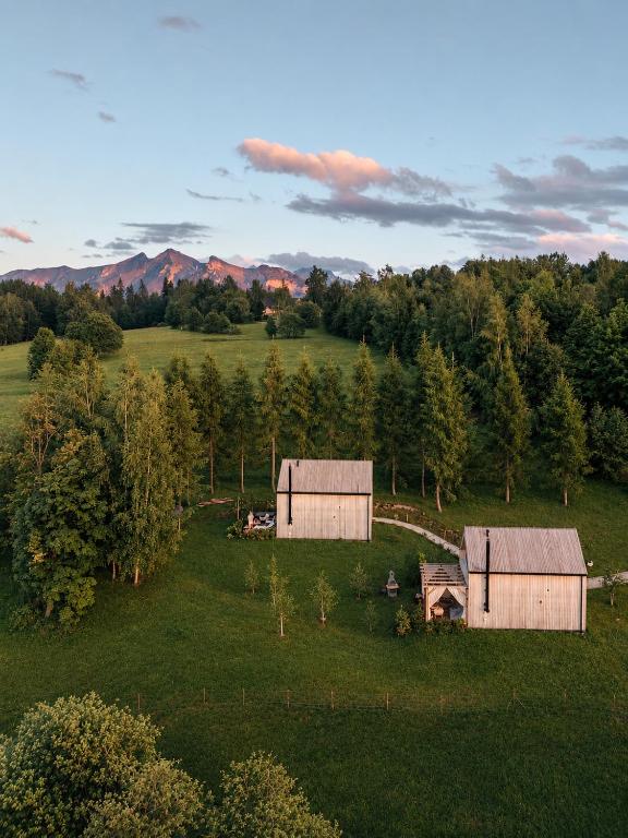 an aerial view of two barns in a field at Wygórowane - nowoczesne stodoły pod Tatrami in Brzegi