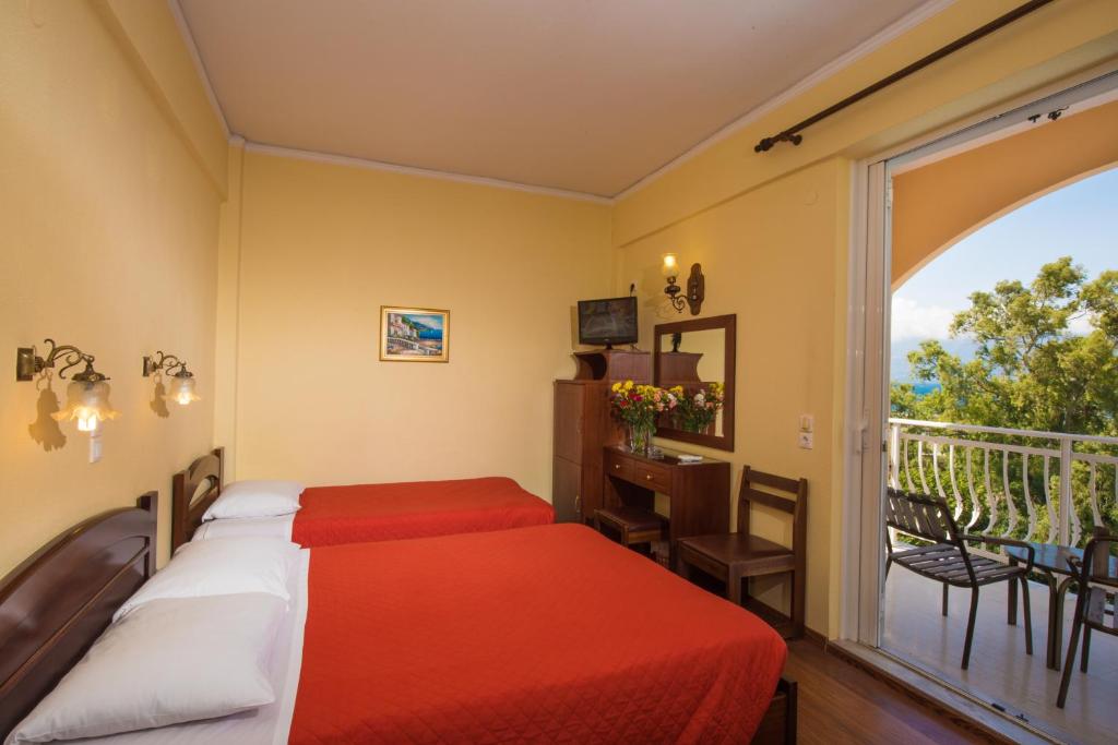 Postel nebo postele na pokoji v ubytování Sunset Hotel