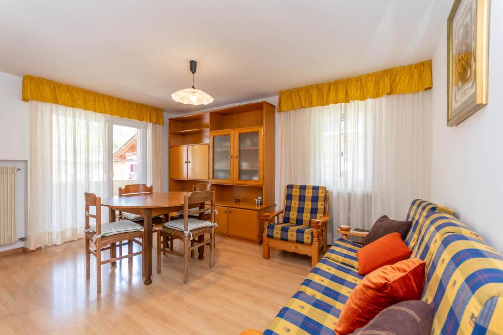 a living room with a couch and a table at Casa Anna in Predazzo