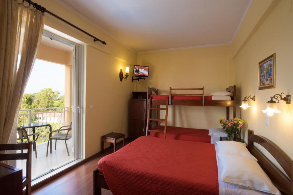 Postel nebo postele na pokoji v ubytování Sunset Hotel
