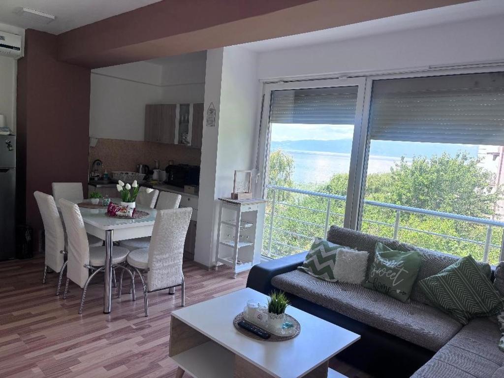 a living room with a couch and a table at APARTMENT ANA v-Peshtani in Ohrid