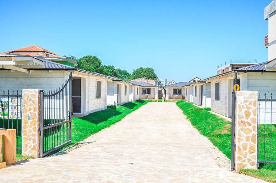 a driveway leading to a row of houses at White house in Donji Štoj