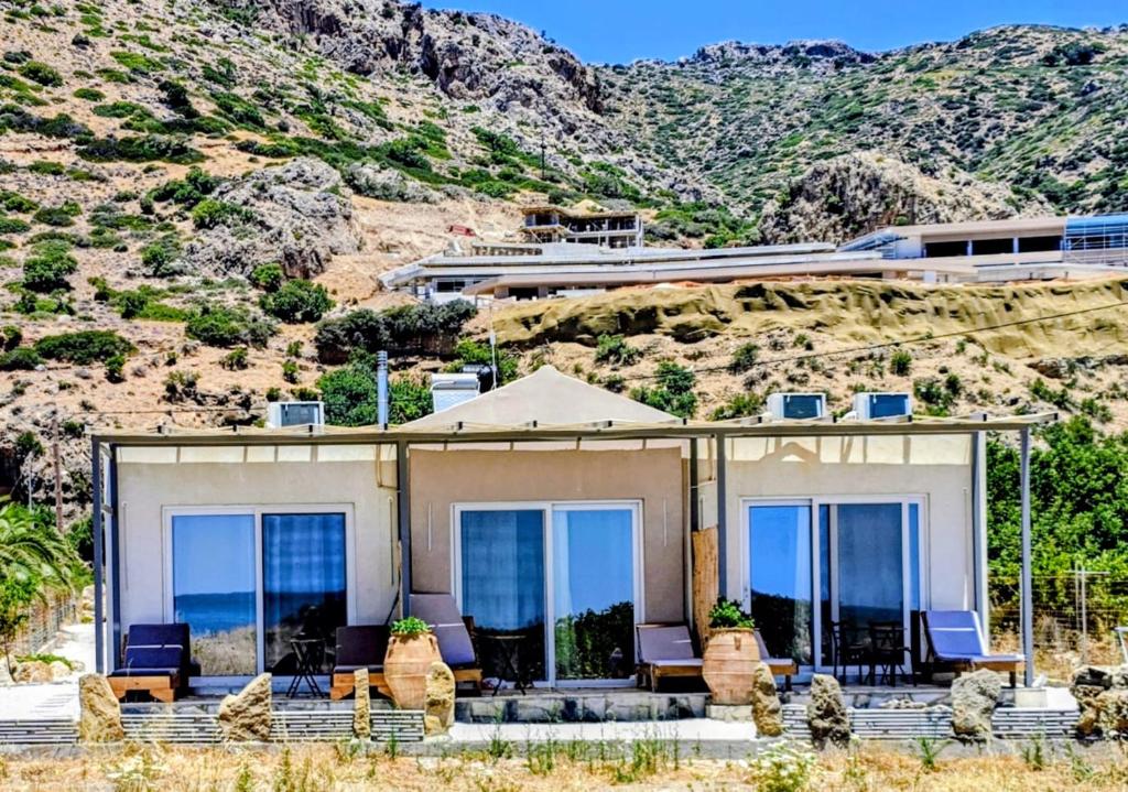 a house with a view of the ocean at A to Z in Palaiochora