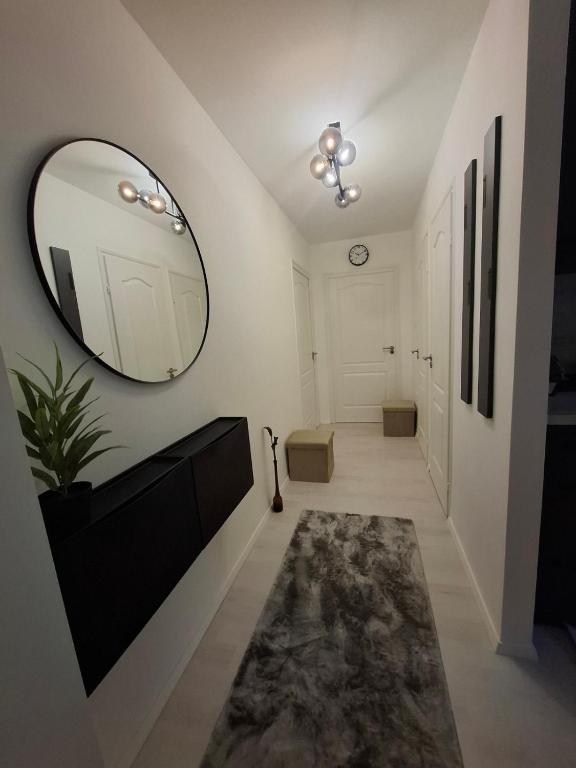 a hallway with a large mirror on the wall at PT Residence in Zalaegerszeg