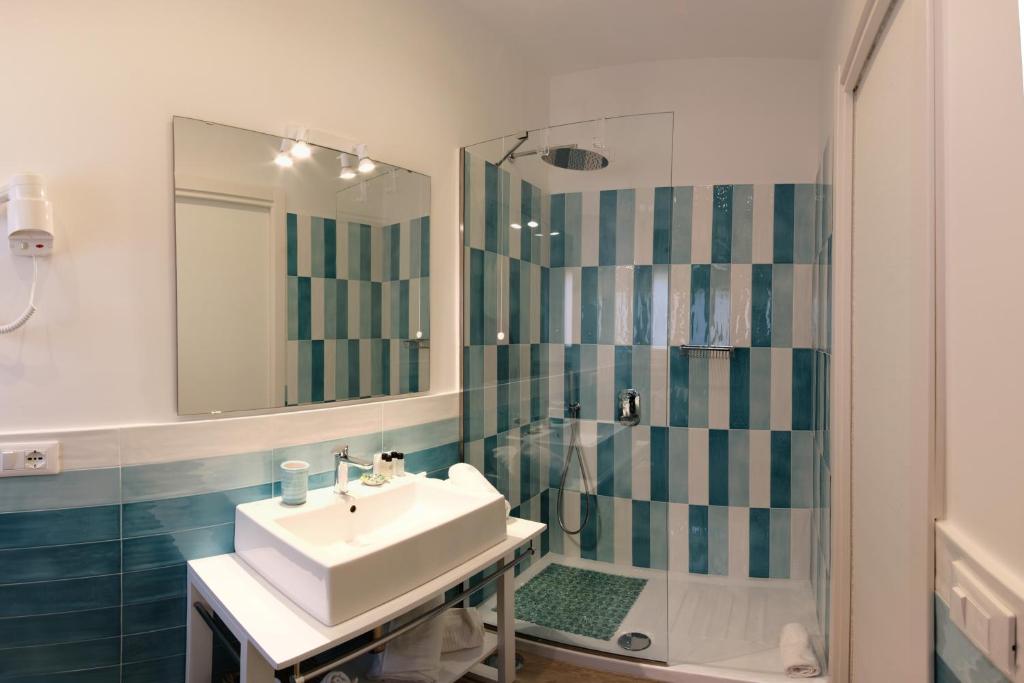 a bathroom with a sink and a shower at Dea Guest House in Sorrento