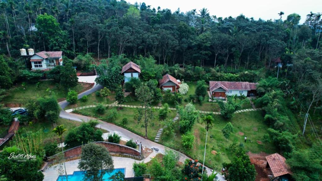 an aerial view of a house in a forest at Skyleaf Resort in Meenangadi