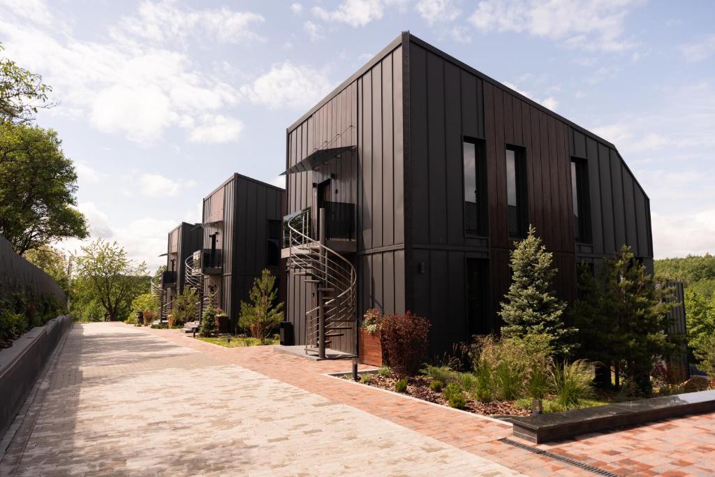 a black house on a brick road at Liso Prostir in Lisopotik