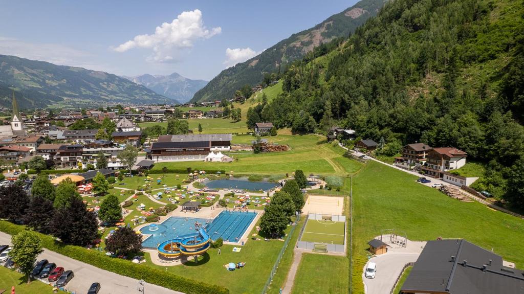 an aerial view of a resort with a swimming pool at Apartments Dorfbäck in Stumm