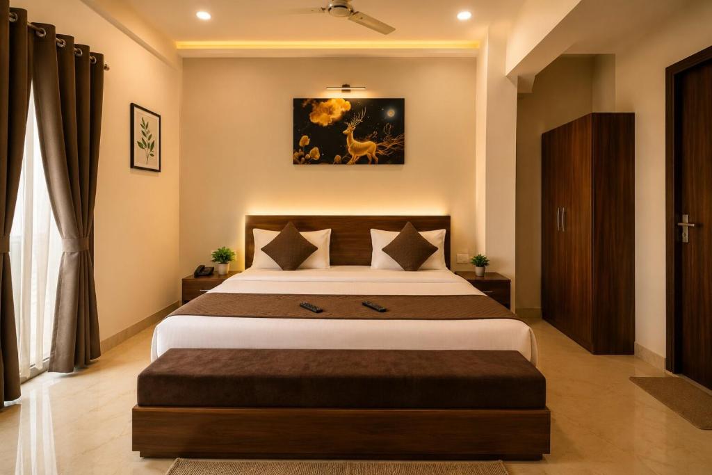 a bedroom with a large bed in a room at Hotel cressida green palace - near redisson squar in Indore