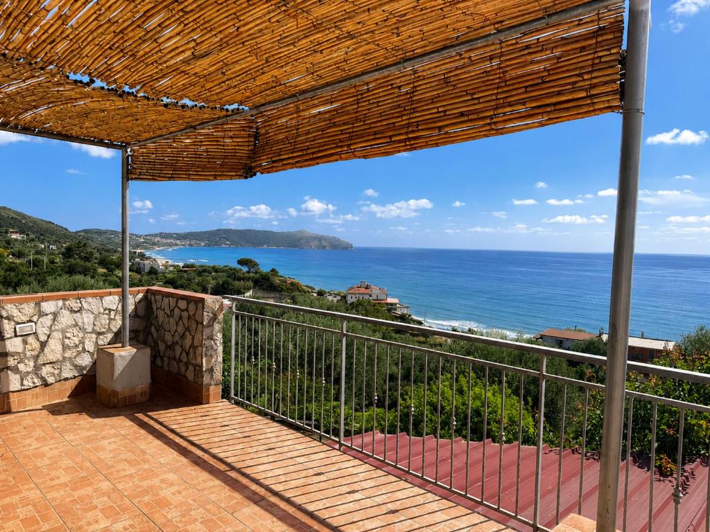a balcony with a view of the ocean at Appartamenti Villa Verde in Caprioli