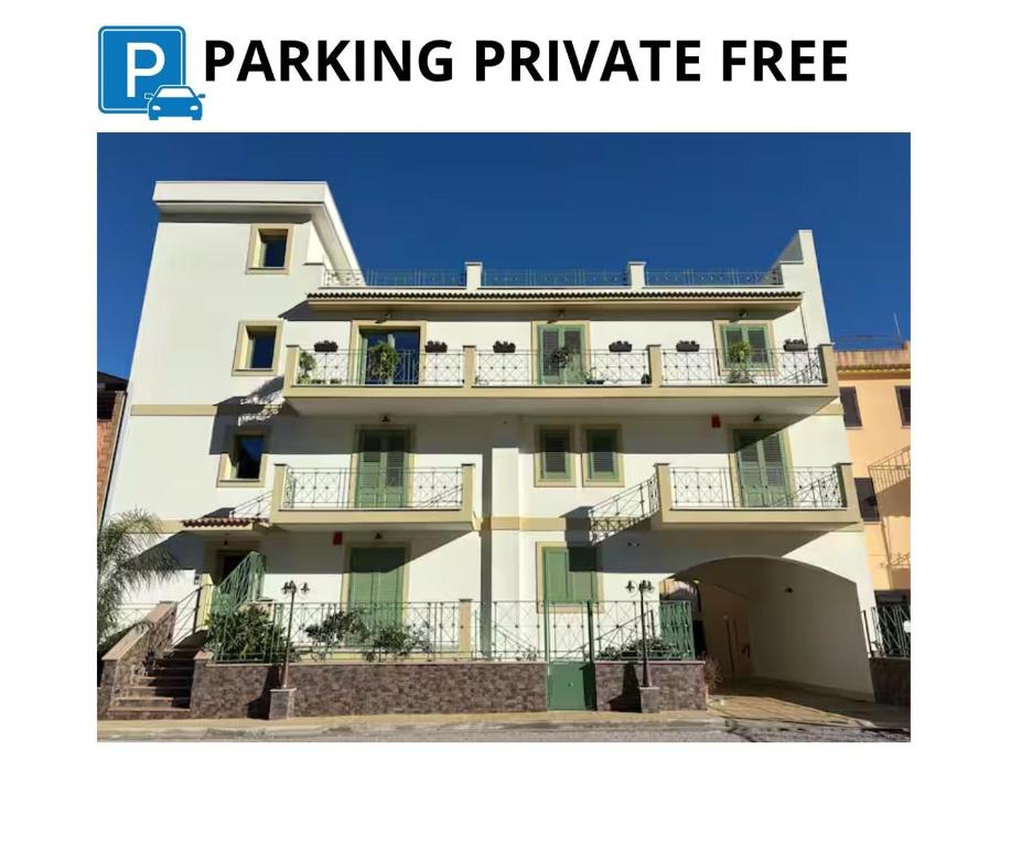 a large white building with balconies on it at La Casa di Zefiro in Santa Flavia
