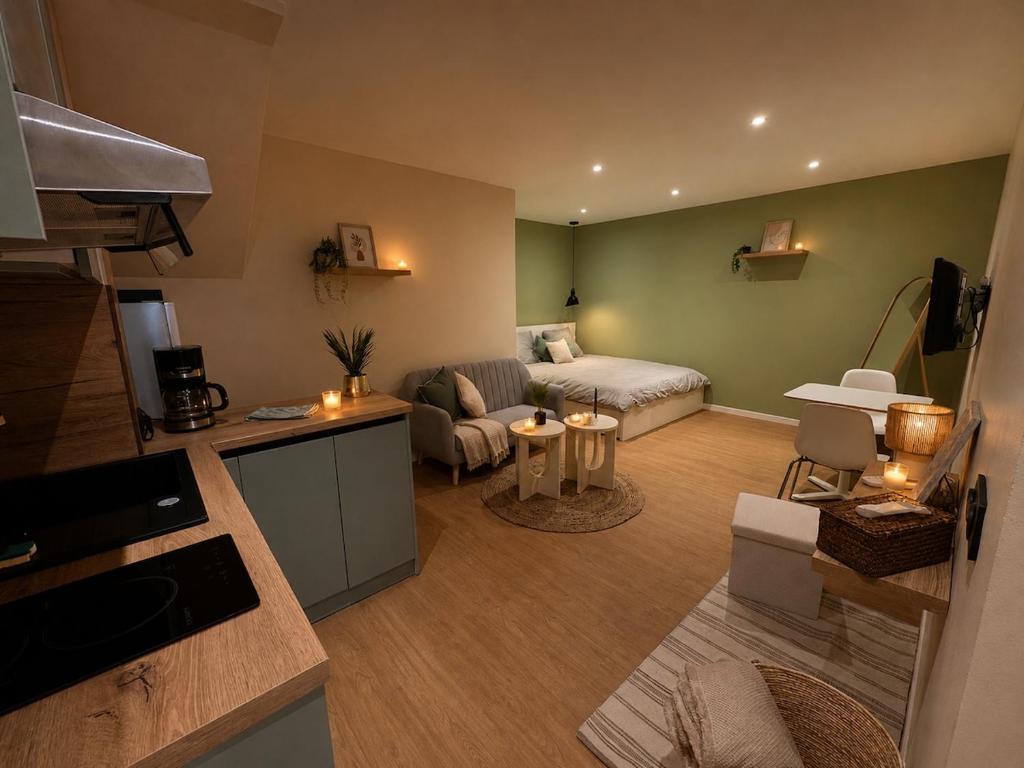 a living room with a couch and a living room with at Côte-et-vins Gîte Le Cocon in Chagny