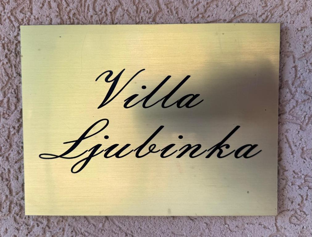 a sign that reads vida flutida flutida at Vila Ljubinka in Brežđe