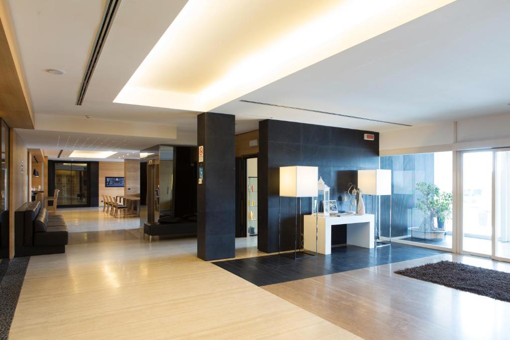 a lobby of an office building with a reception desk at Hotel Pineta Wellness & Spa in Ruvo di Puglia