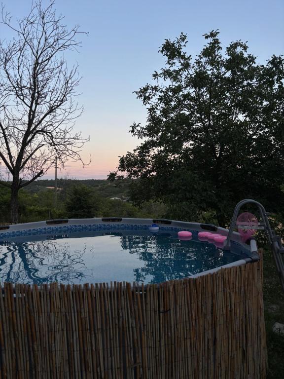 a small swimming pool with a water slide at Vikendica Dora in Petrovaradin
