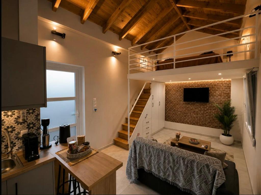 ein großes Wohnzimmer mit einer Treppe zum Dachboden in der Unterkunft TheAiryLoft in Mytilini