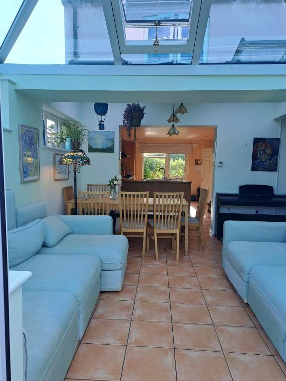a living room with a couch and a table at Character Cottage in Wallingford in Wallingford