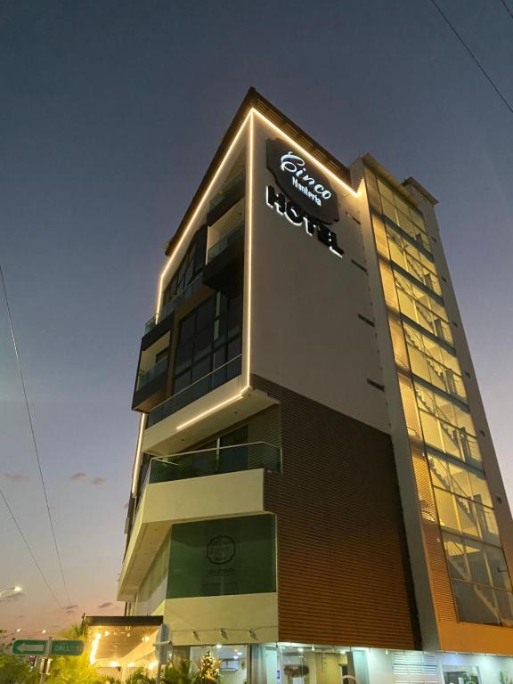 a building with a samsung sign on the side of it at Hotel Cinco Monteria in Montería