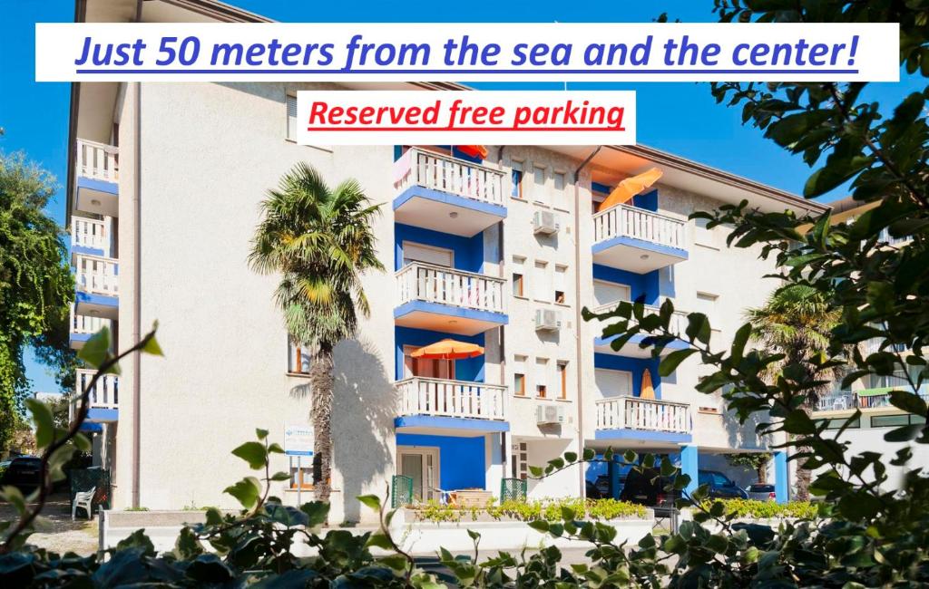 a building with a sign that reads just meters from thesea and the center at Ca'Costanza in Bibione