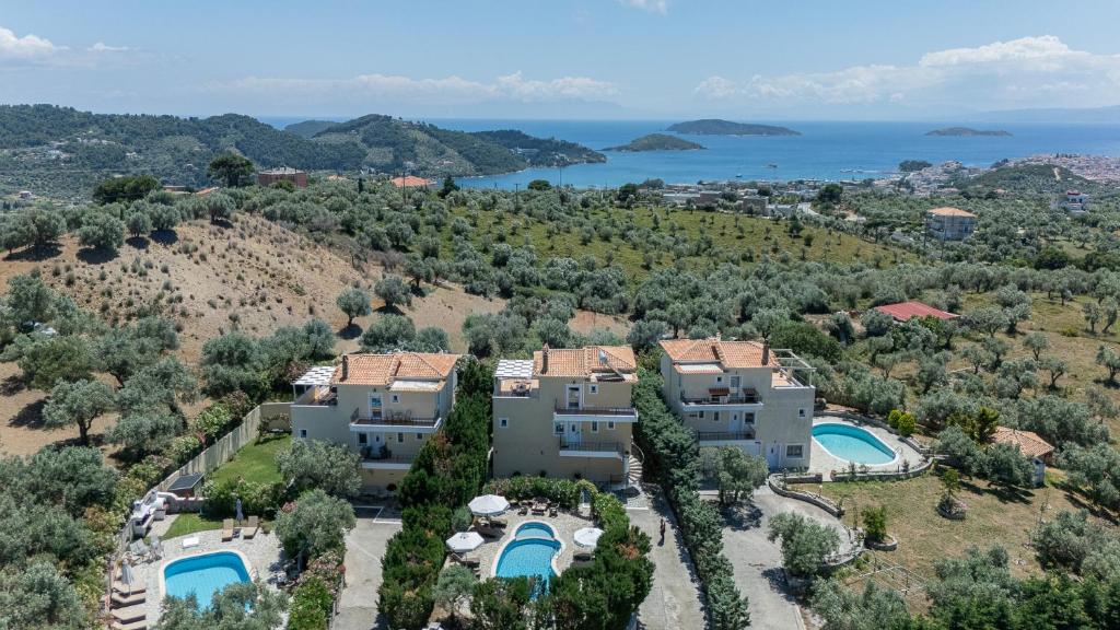 an aerial view of a house with two swimming pools at Sunset Villa Amelia Skiathos in Skiathos National Airport