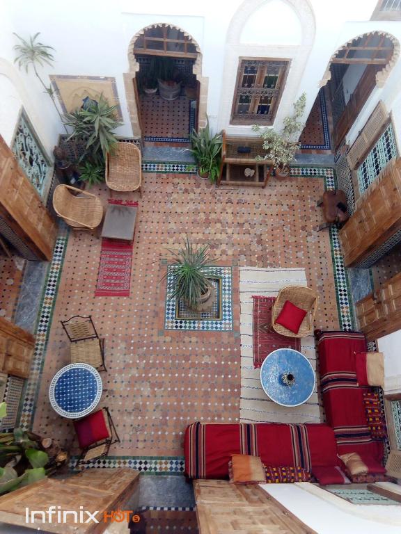 an aerial view of a courtyard with tables and chairs at Riad Kasbah in Rabat