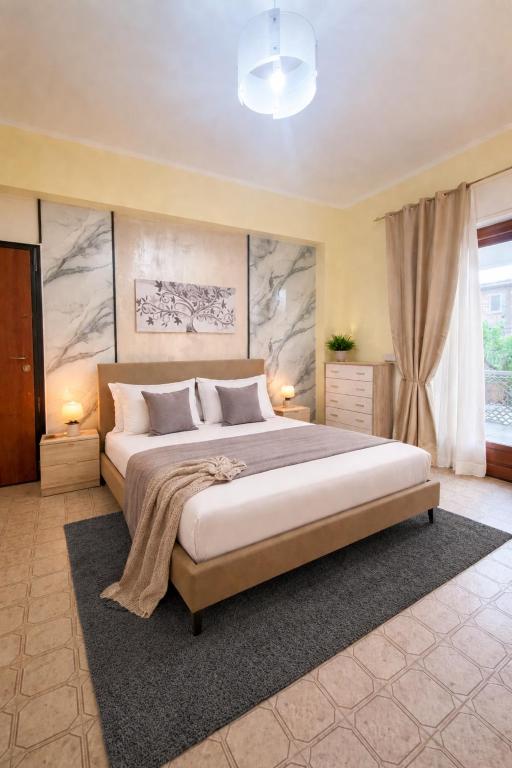 a bedroom with a large bed in a room at Suite la Ficara in Bovalino Marina