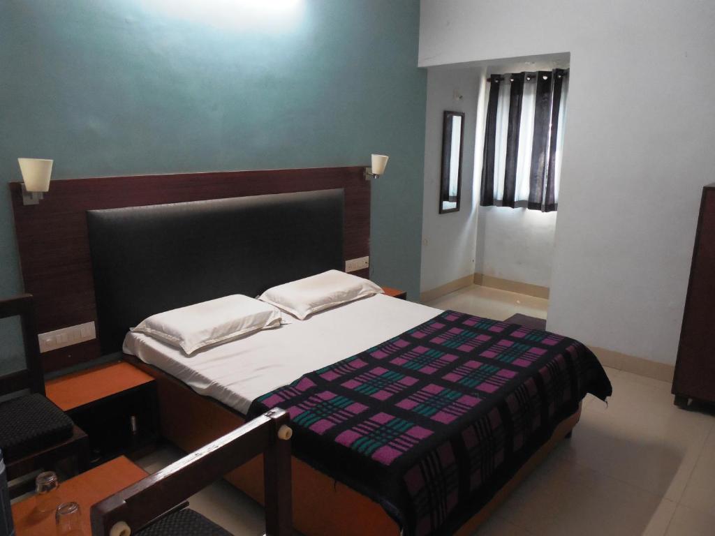 Postel nebo postele na pokoji v ubytování Hotel Silver Springs