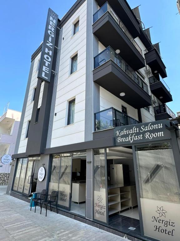 a building with a sign on the front of it at Nergiz Boutique Hotel in Antalya