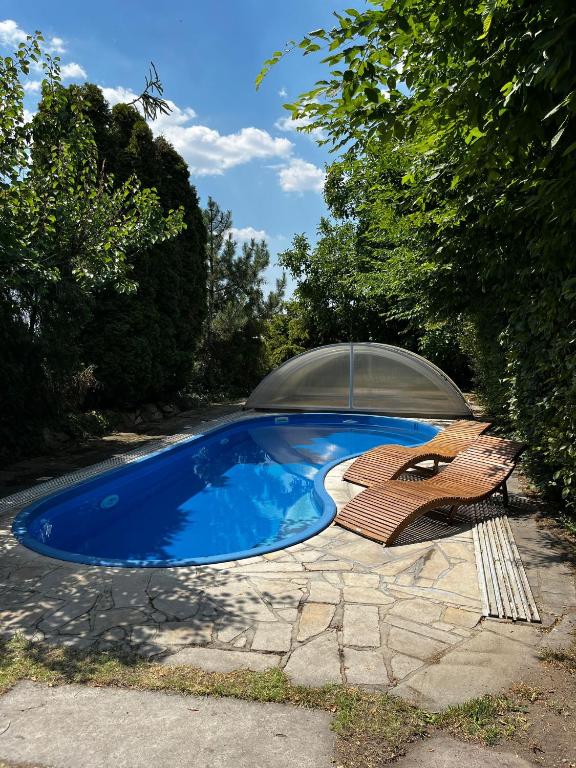 a small blue swimming pool with a glass dome at Boutique Hotel Templ in Mikulov