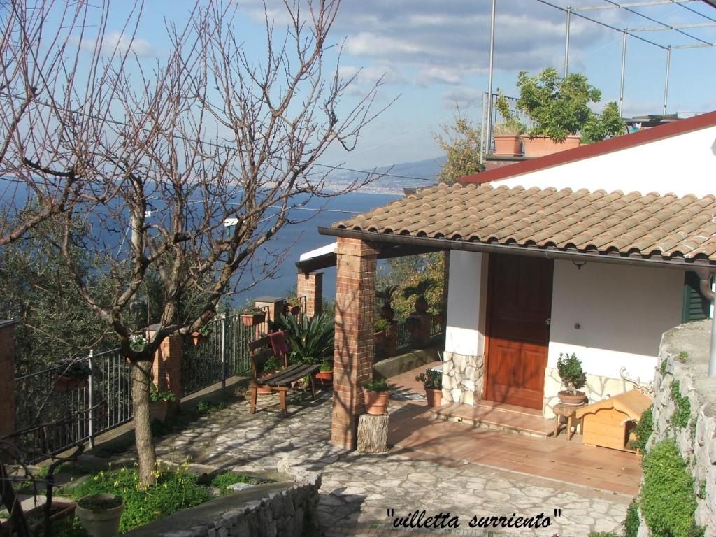 a house with a view of the water at Villetta Surriento in Sorrento