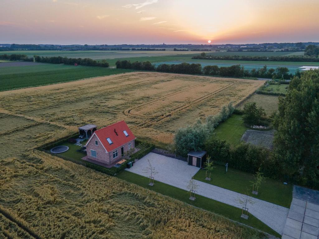 an aerial view of a house in the middle of a field at NIEUW Landzicht in Serooskerke