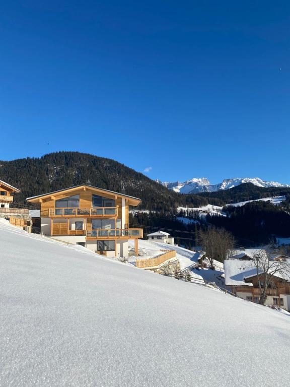 a house on the side of a snow covered mountain at Apartment 225 in Forstau