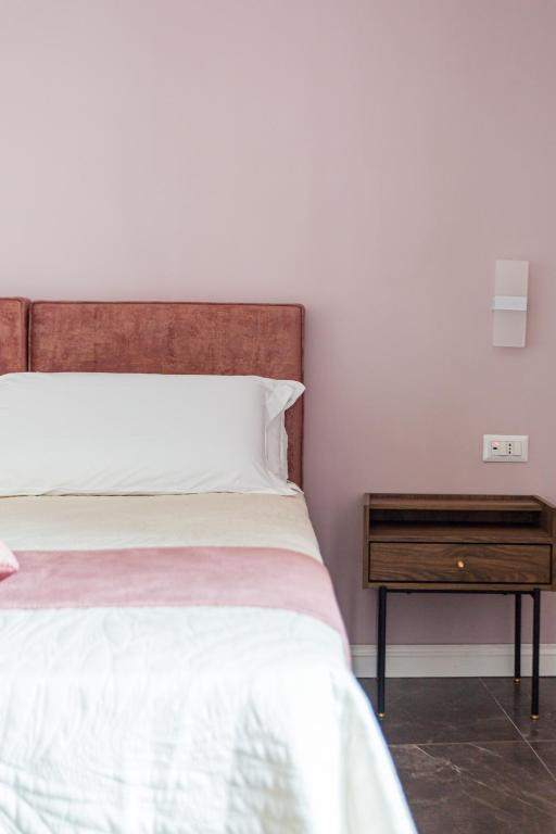 Voodi või voodid majutusasutuse Amendola Rooms toas