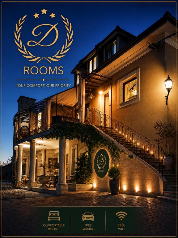 a sign on the side of a house at night at D Rooms Boutique Stay with Parking & Fast City Access in Ljubljana