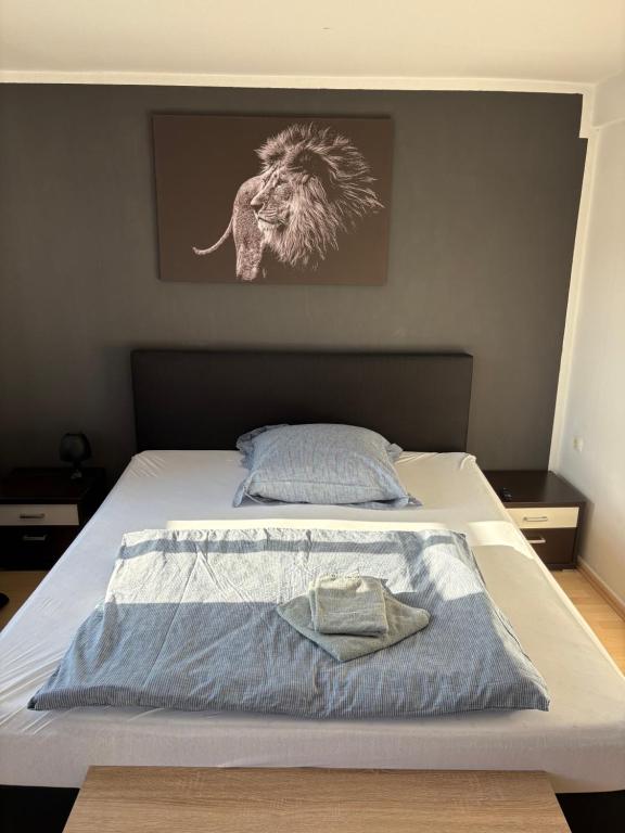 a bedroom with a bed with a picture of an elephant at Fluss-Bett in Melsungen