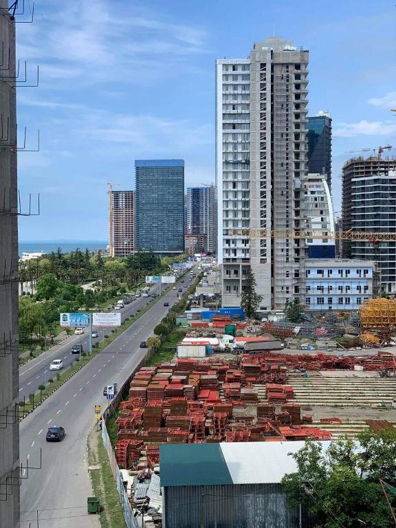 a view of a city with buildings and a highway at Ideal home in Minda