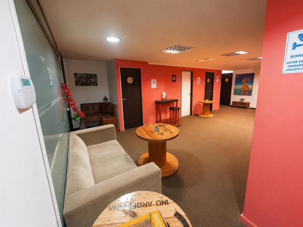 a living room with a couch and a table at Estudio Residencias in Buenos Aires