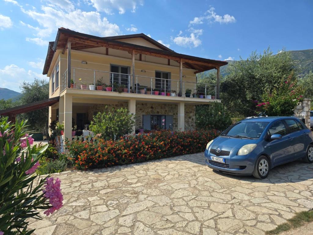 a small car parked in front of a house at Villa Theodora in Himare