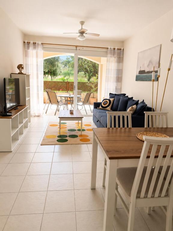 a living room with a couch and a table at Athena Apartment in Polis Chrysochous