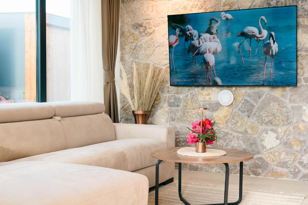 a living room with a couch and a table at Salinas Nest - Ulcinj Stoj Ada Bojana in Ulcinj