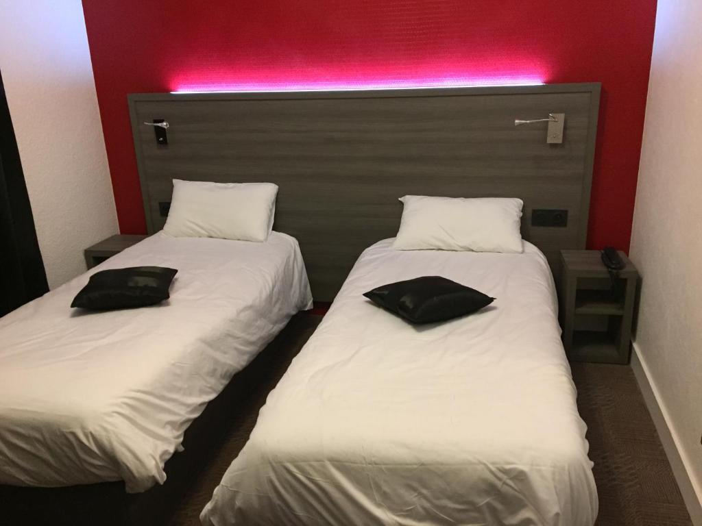 Postel nebo postele na pokoji v ubytování Le Beverl'inn