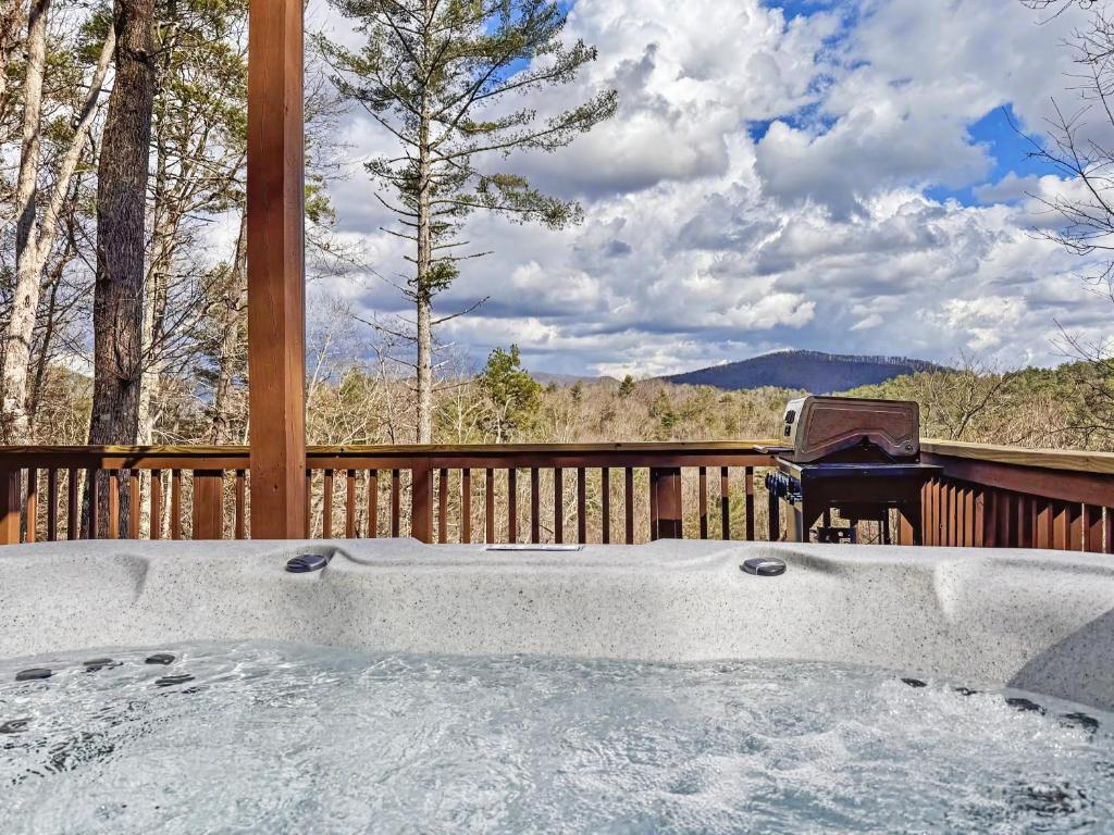 a hot tub on a deck with a piano at Mountain Views, Game Room, Firepit Near Wineries in Cleveland