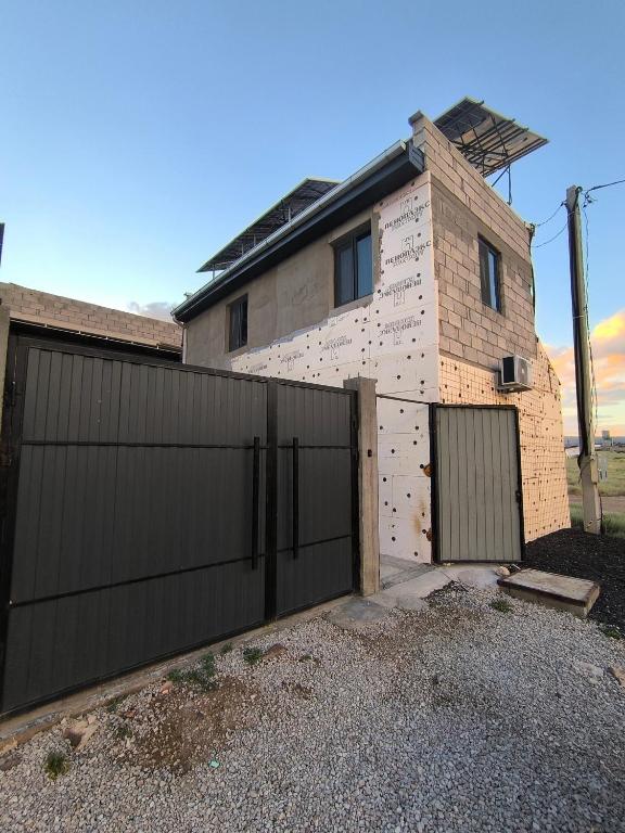 a house that is being built with a fence at Ashtarak home in Ashtarak