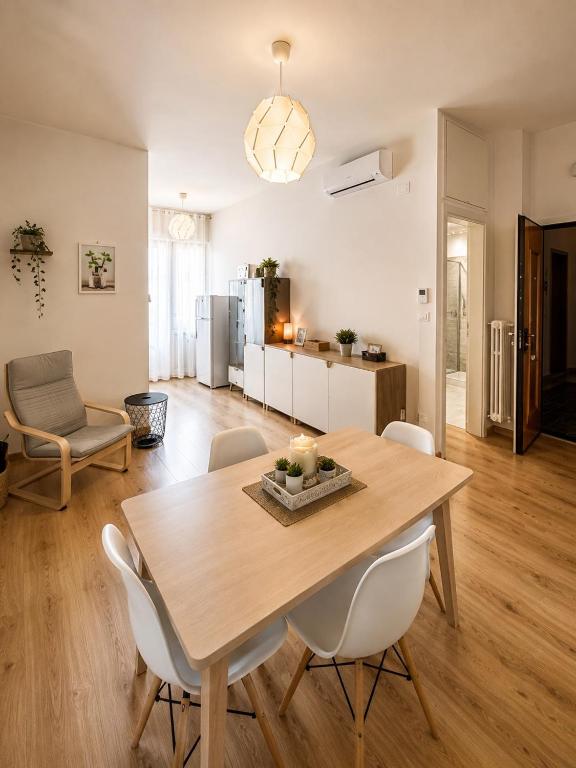 a dining room and living room with a table and chairs at Piazza Sant'Alfonso Apartment in Francavilla al Mare