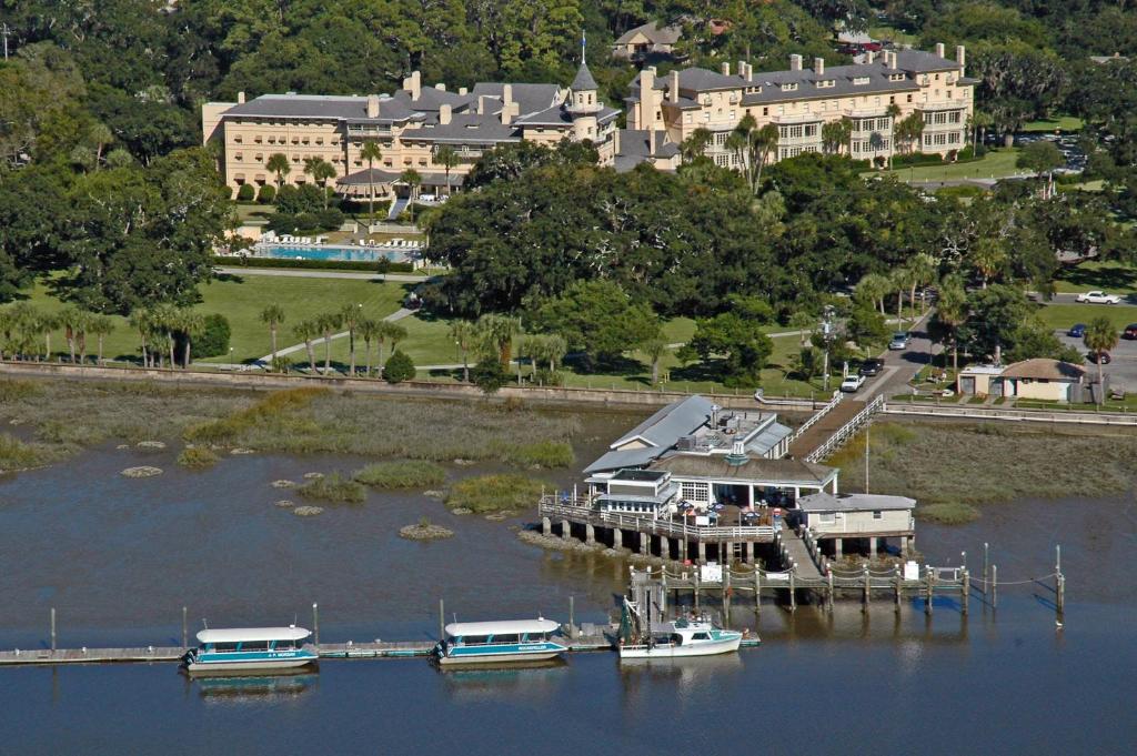 a group of boats docked at a dock on a lake at Jekyll Island Club Resort in Jekyll Island