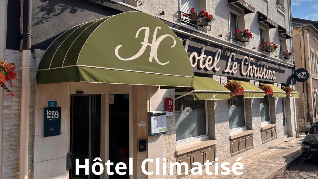 a hotel clinic with a green awning on a building at Logis - Le Christina in Bourges