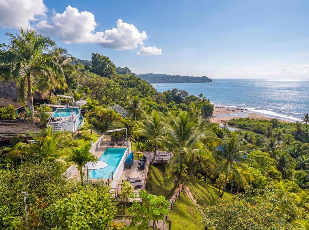 an aerial view of a resort with a beach at The Tranquilo Lodge, Adult Only, All meals included in Drake